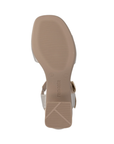 Tan light treaded outsole with Remonte logo near block heel.