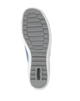 Grey treaded outsole of sneaker with green Remonte logo on heel.