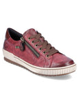 A red leather lace-up sneaker with a zipper on the side, an off-white midsole and brown outsole.