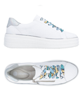 Pair of white lace-up platform sneakers with colorful laces, side zipper, silver heel accent, Remonte grey logo'd footbed and white outsole.