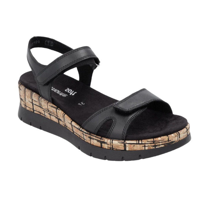 A black backstrap platform wedge sandal with a cork-textured midsole, black Remonte logo'd footbed and black outsole.