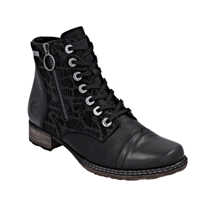 Black lace-up dress boot with a side zipper, accent patterned upper, siler eyelets and a low block heel.