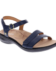 Navy strappy sandal with gold circle buckle detail, tan Revere logo'd footbed and black outsole.