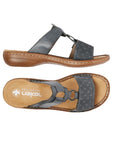 Pair of blue slide sandal with two Velcro straps, textured details and medallion accent, tan Rieker logo'd footbed and brown outsole.