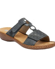 Blue slide sandal with two Velcro straps, textured details and medallion accent, tan Rieker logo'd footbed and brown outsole.