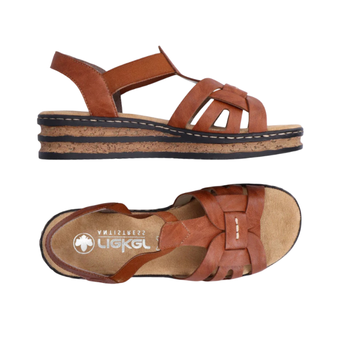Pair of Brown gladiator inspired backstrap sandals with faux cork platform midsole, tan Rieker logo'd footbed and black outsole.