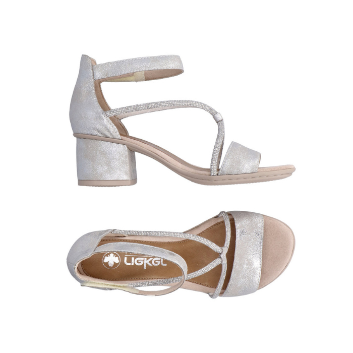 Pair of Silver sandals with decorative sparkly straps, Velcro ankle strap, tan Rieker logo'd footbed and a block heel.