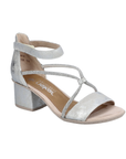 Silver sandal with decorative sparkly straps, Velcro ankle strap, tan Rieker logo'd footbed and a block heel.