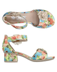 Pair of Rieker block heels with silver flower on velcro ankle and toe straps, Blues and pinks in the flower pattern uppers and a beige logo'd footbed.