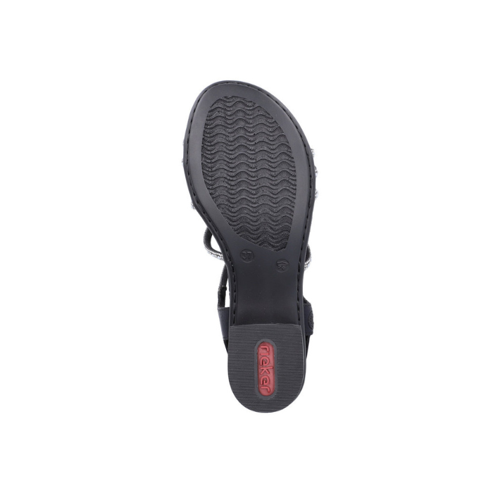 Light treaded outsole of block heel sandal with Rieker logo on base of heel in red.
