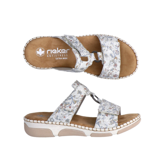 Pair of Floral-patterned slide sandals with Velcro straps, Rieker tan footbed and beige and white outsole.
