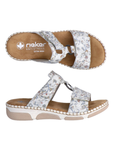 Pair of Floral-patterned slide sandals with Velcro straps, Rieker tan footbed and beige and white outsole.