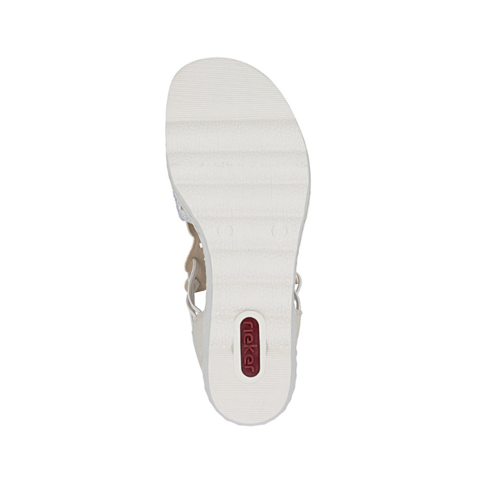 White light treaded outsole of wedge sandal with red Rieker logo on heel.
