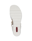 White light treaded outsole of wedge sandal with red Rieker logo on heel.