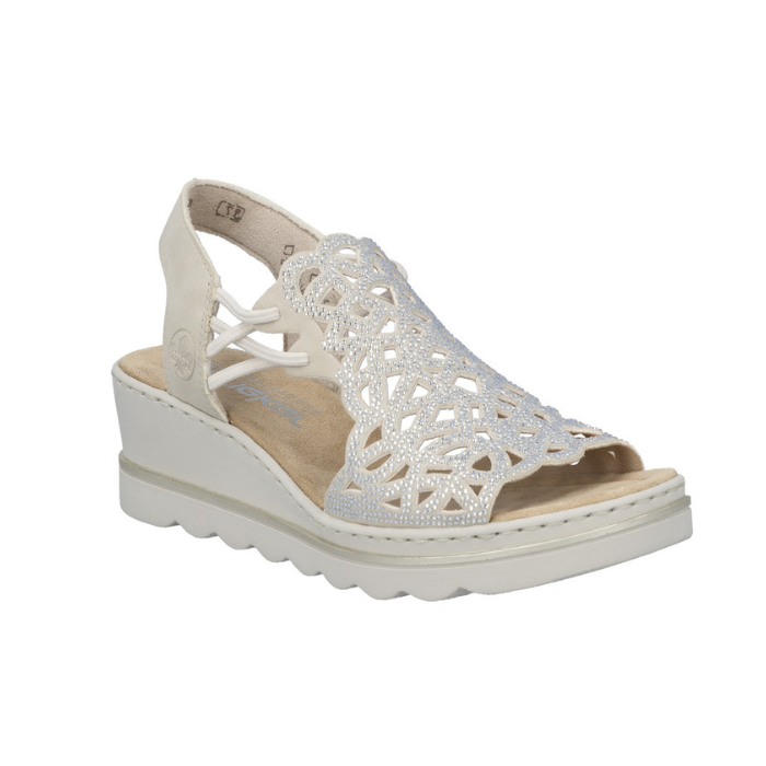 Beige caged backstrap sandal with rhinestone details, tan Rieker logo'd footbed and a wedge heel.
