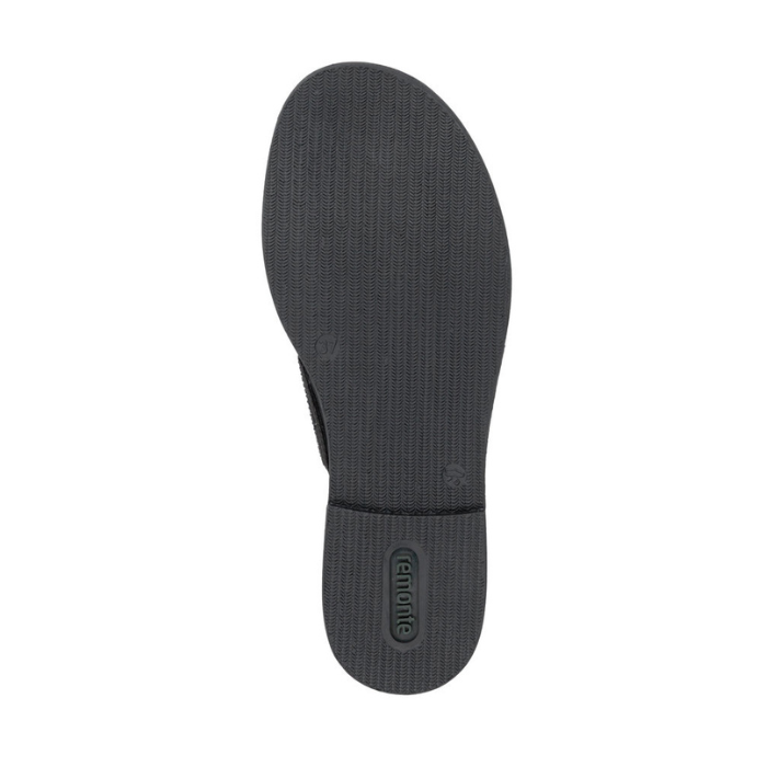 Black light treaded outsole of sandal with green Remonte logo stamped in heel.