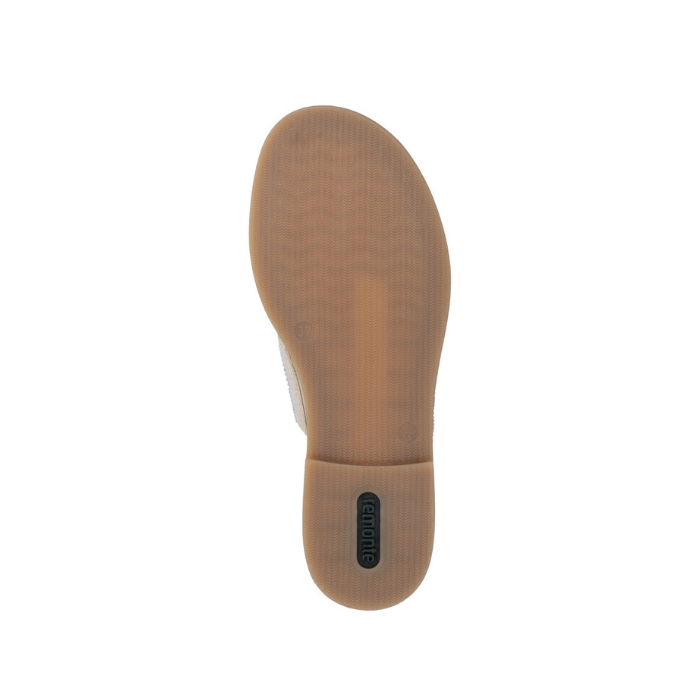 Light treaded outsole of sandal with Green Remonte logo stamped on heel.