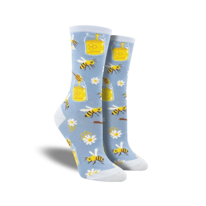 Light blue socks with bees, flower and honey jar pattern.