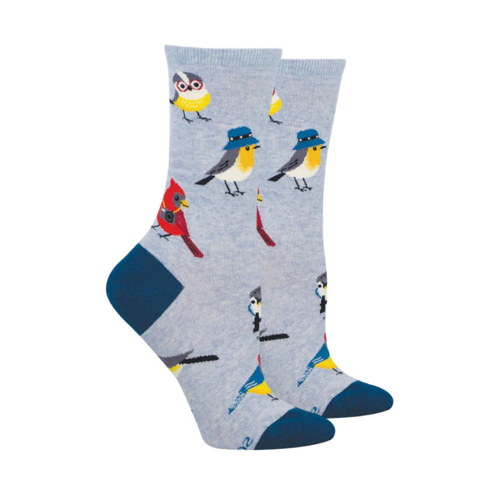 Blue socks with various birds wearing hats, glasses and cameras.