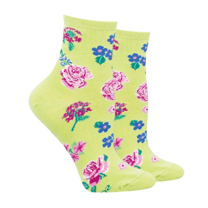 Green socks with various flowers in pinks, blues and purples.
