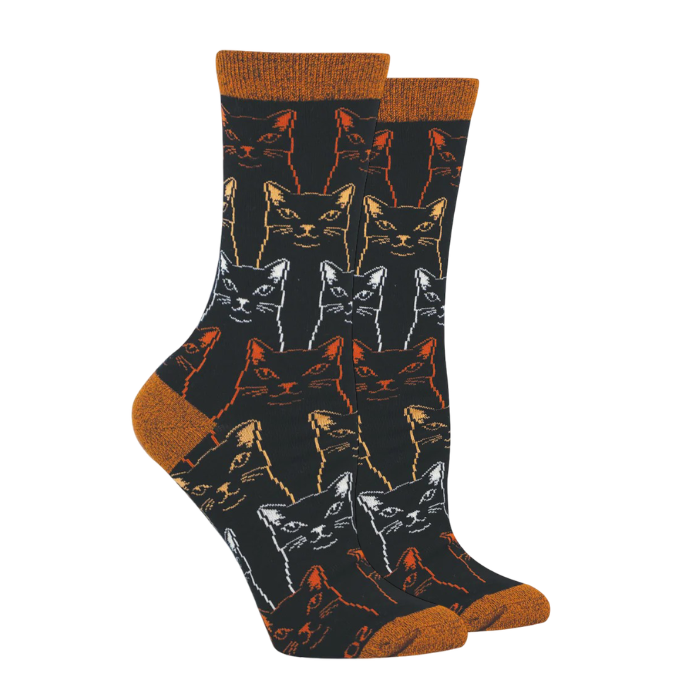 Black socks with sketched cats in yellow, orange and white with orange cuff, heel and toe caps.
