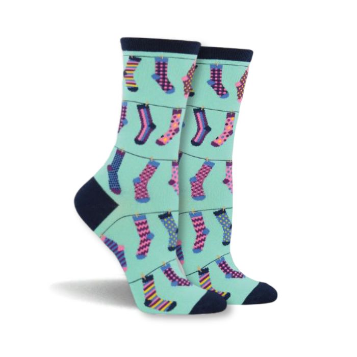 Women's teal socks with brightly colourful socks hanging on close lines across.