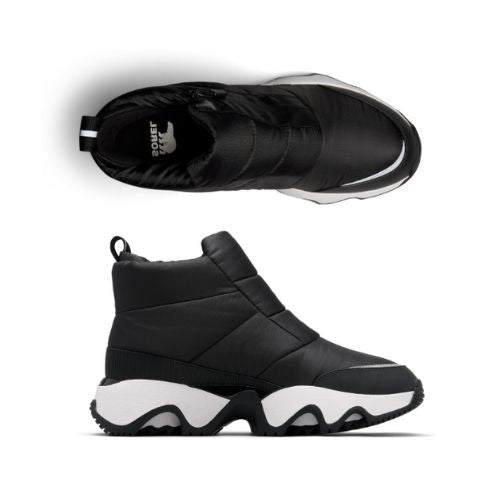 Pair of A black Puffy upper front Zip Ankle Boots with white midsole, Sorel logo on black footbed and a wave pattern rubber outsole.