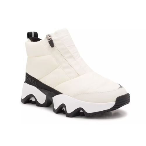 A white Puffy upper front Zip Ankle Boot with white midsole and a wave pattern rubber outsole.