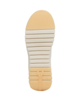 Beige and yellow outsole with flexible treaded pattern and Vionic logo on heel.