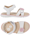 Pair of White kid's backstrap sandals with textured edges on straps, pink 3D flower on toe strap, tan footbed and white outsole.