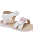 White kid's backstrap sandal with textured edges on straps, pink 3D flower on toe strap, tan footbed and white outsole.