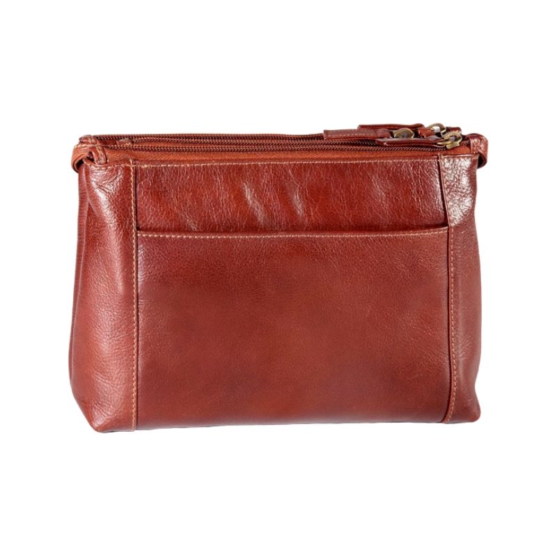 Viewing the back slip pocket of the Derek Alexander hand bag in the Whiskey colour with a shoulder strap.