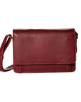 Whiskey  leather clutch style hand bag with front flap pocket and adjustable strap by Derek Alexander