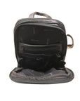 Interior of first compartment of the backpack, displaying zippered pocket and slip pockets. 
