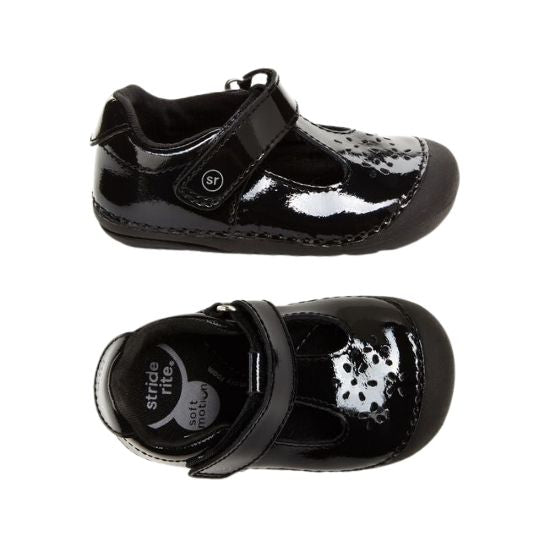 Top and side view of black patent leather mary jane with floral cutout detail