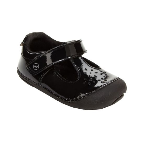 Black patent leather Mary-Jane with floral cutout detail.