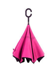 Closed Knirps reversible umbrella has c-shaped handle with pink and black design.