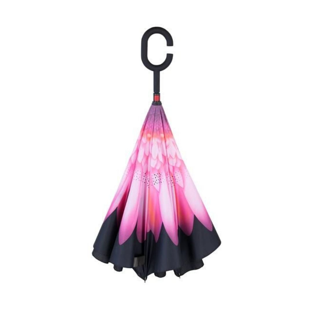 Closed Knirps reversible umbrella has c-shaped handle with pink flower on centre and black edges