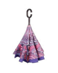 Loosely Closed Knirps reversible umbrella has c-shaped handle with purple paisley design
