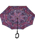 Open Knirps reversible umbrella has c-shaped handle with purple paisley design