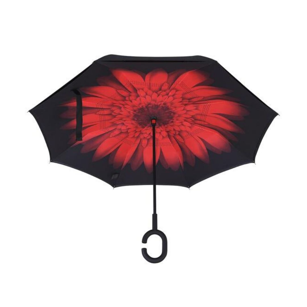 Open Knirps reversible umbrella has c-shaped handle with red flower from centre with black edges