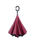 Closed Loosley Knirps reversible umbrella has c-shaped handle with burgundy and black on top
