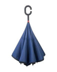 Closed loosely Knirps reversible umbrella has c-shaped handle with Blue  and black on top