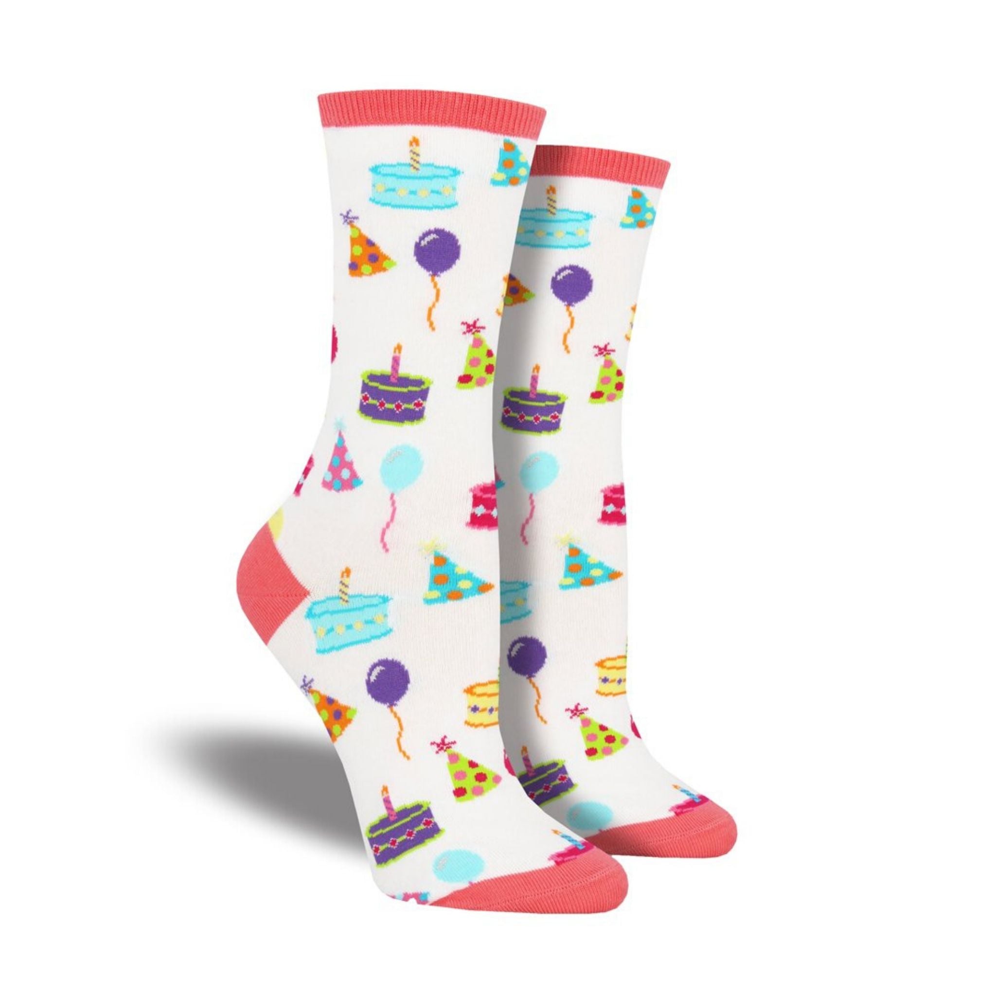 A pair of women's white crew socks featuring birthday cake and hats.