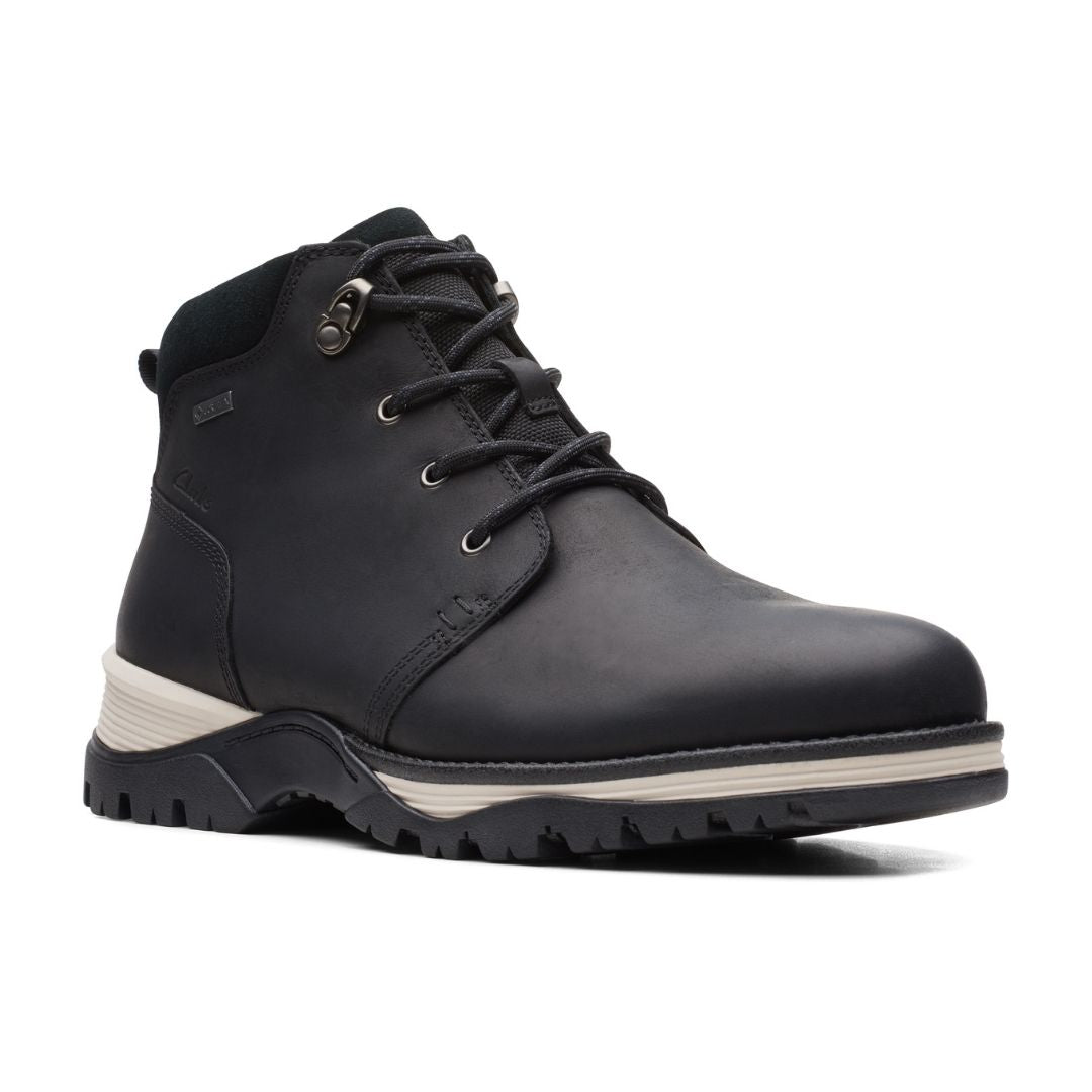 Black leahter lace up ankle boot with white accents on midsole.