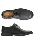 Top and side view of black leather dress shoe with laces and black outsole. Clarks logo on heel of insole.