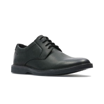 Black leather dress shoe with laces and black outsole.