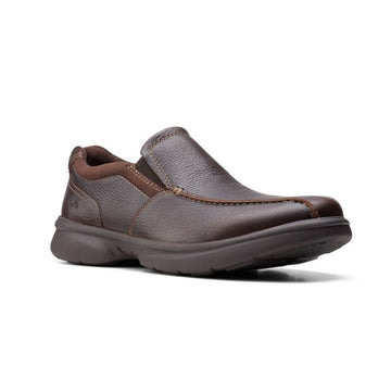Brown leather slip-on shoe with brown outsole. Clarks logo imprinted on outside of heel.