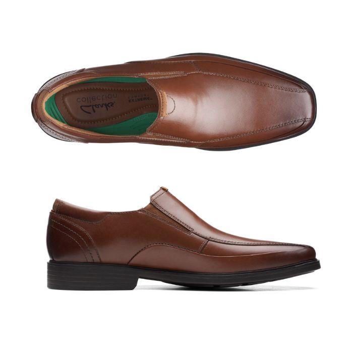 Brown leather bicycle toe slip-on shoe with black outsole. Clarks logo printed on heel.