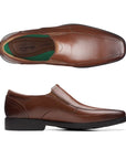 Brown leather bicycle toe slip-on shoe with black outsole. Clarks logo printed on heel.